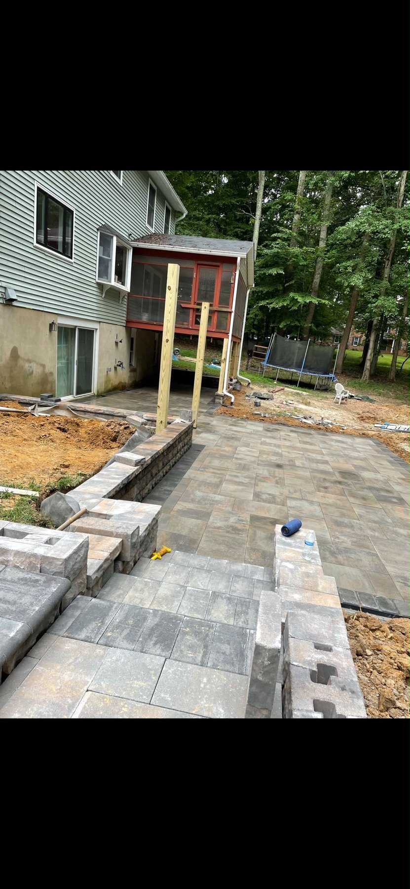 Paver patio and retaining wall project by Fredy Cortez Landscaping
